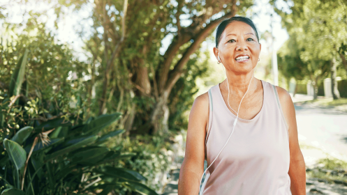 middle-aged woman with menopause jogging in the park